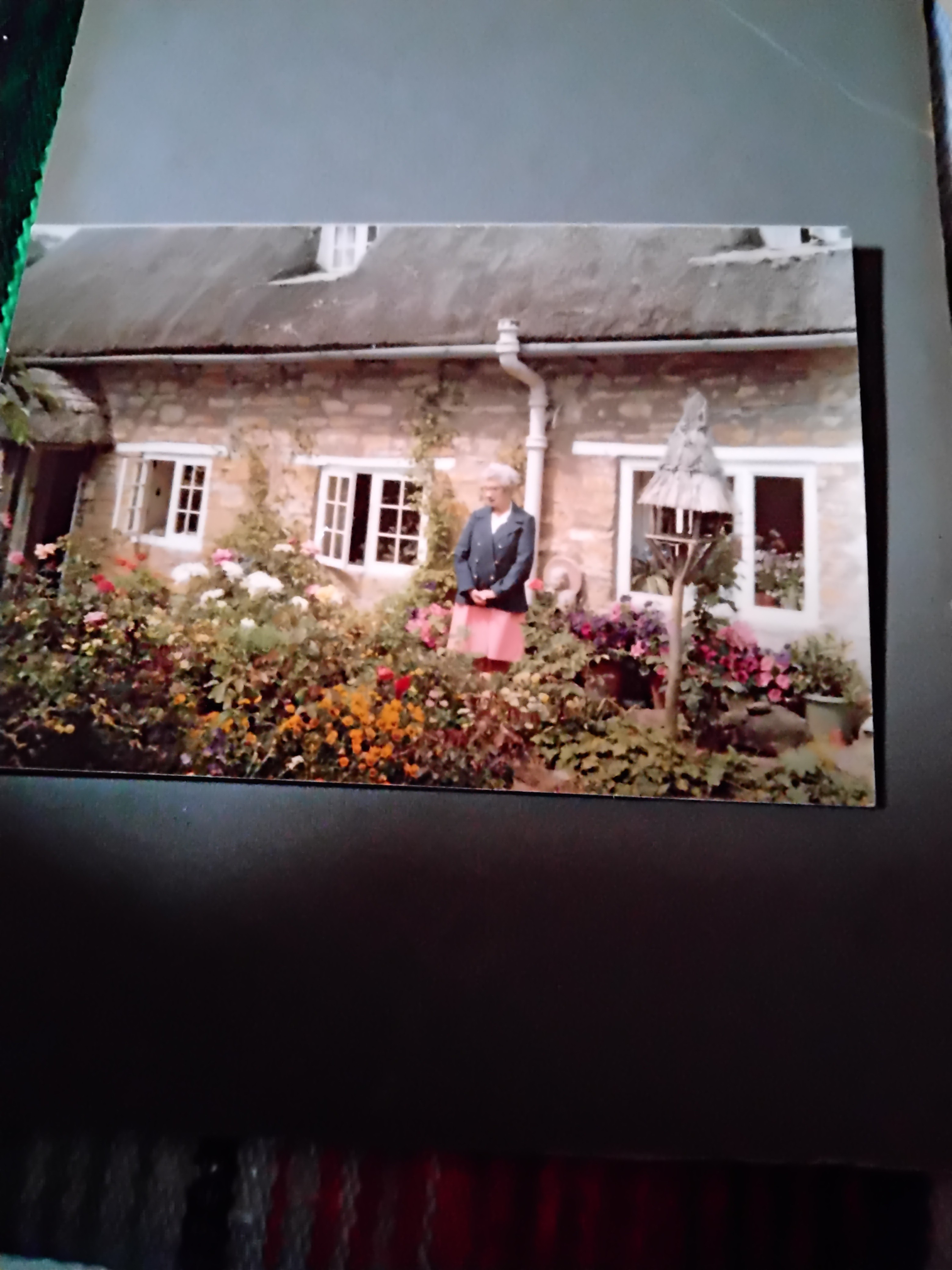 Dorothy Rendell outside cottage